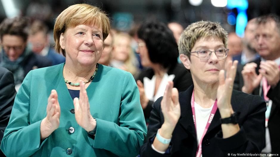 Germany news: Merkel urges patience for Merz's coalition